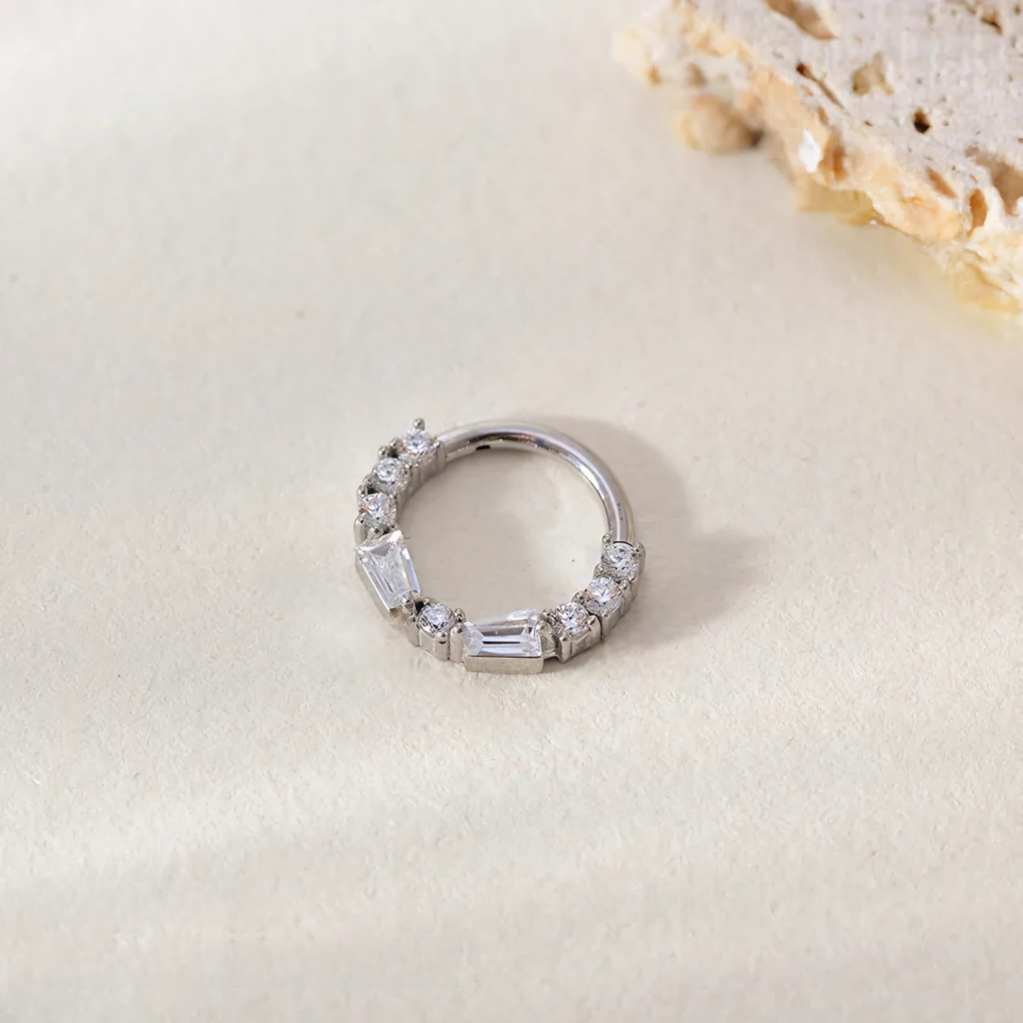 "Collection of stylish nose rings including studs, hoops, and rings"