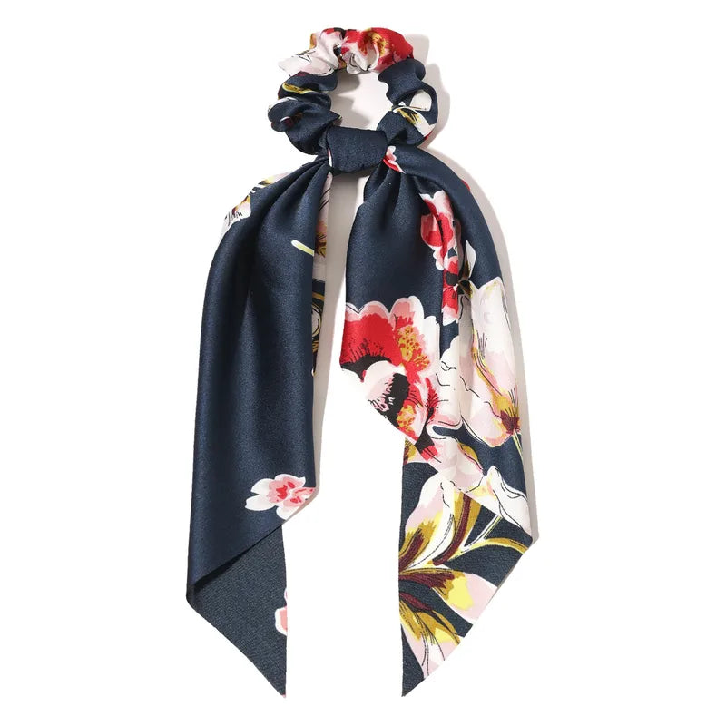 Navy blue floral-patterned hair scarf on a white background
