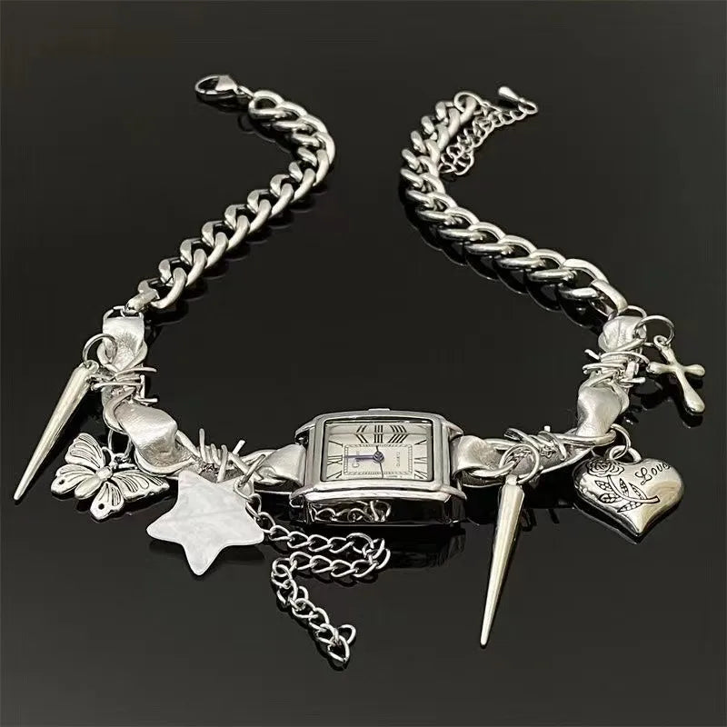 Silver Choker with various charms on a black background