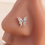 Silver butterfly nosering on a blurred background