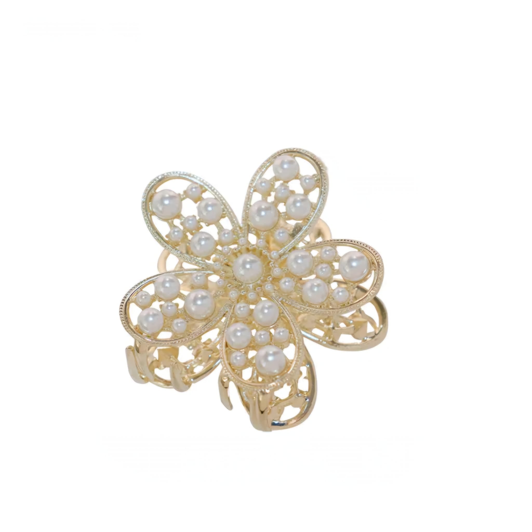 Gold clip with pearl embellishments on a white background