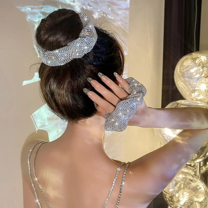 Person wearing a sparkling headband scrunchies in an elegant setting